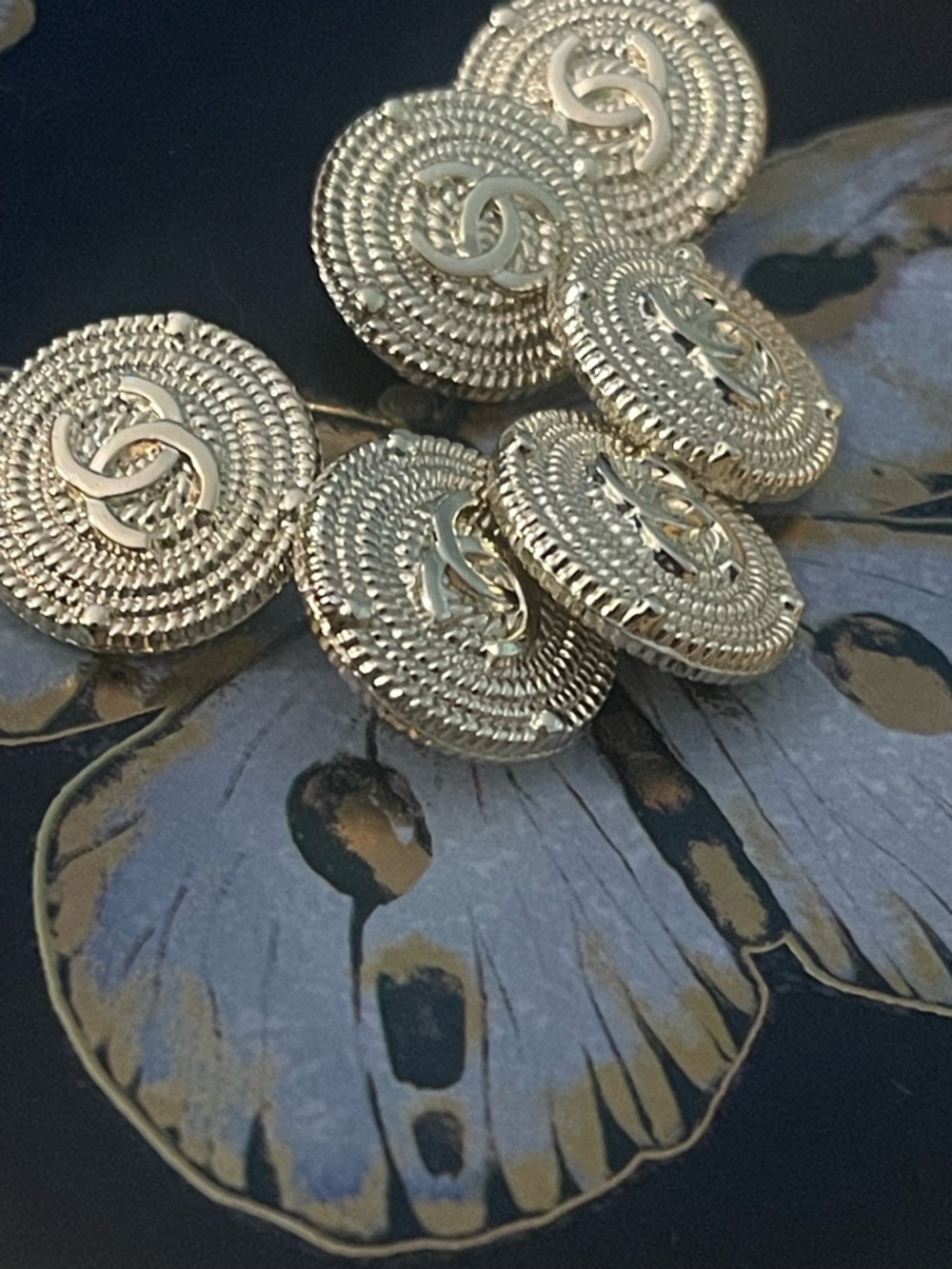 Set of 4 stamped Chanel buttons